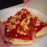 1 slice vegan. With mock sausage (fool any meat eater with this meatless option)  sorry was in the process of cutting but that's 1 slice :) love it at Loving Hut in Fresno