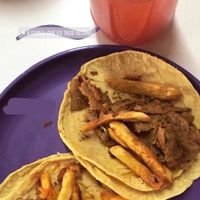 agua del día (fresa), taco de pastor de trigo y taco de arrachera de soya. at A Darle Que es Taco Vegano - Churubusco in Mexico City