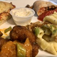 Chicken parm sandwich, mushroom sausage calzone, Demons (buffalo cauliflower wings (came with ranch)), and fire proof (mac n cheese w/ jalapeño and fried onion). Delicious!!  at Mozzarella Fellas in Winston-salem