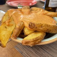 2nd patatas bravas after claiming the hair  at La Tabla De Sitges in Sitges