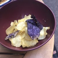 Burgers come with a side of assorted crisps    at Caju in Nice