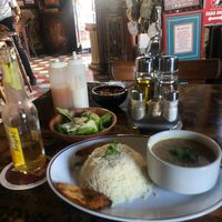 Pinto beans and rice. Salad with cheese on it :( at Charlie's Bar & Restaurant in San Nicolas