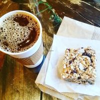 Coffee with almond milk and one of their delicious vegan bars!  at Coffee Plant Roaster in Eugene