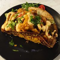 Taco filled with fried oyster mushrooms and minced tofu at Zielona in Lodz