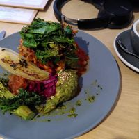 Vegan Fry Up. A stack of hash browns and green. at Idle Hands in Manchester