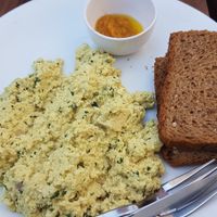 scrambled tofu missing tomato and the spinach is minimal and mixed in at Pure Soul Cafe in Rishikesh