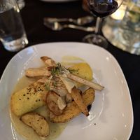 Spinach, caramelized onion, roasted black trumpet mushroom, cashew cheese filled crepe with roasted carrots and fingerling potatoes, on a saffron cream sauce finished with toasted  at Harvest Beat in Seattle