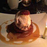 Stuffed apple with ice cream and pecans with my birthday candle  at Harvest Beat in Seattle