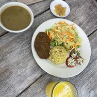 Mushroom soup, mango juice, apple dessert and main dish of the day.   at Veggie Life in Medellin