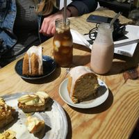 Lemon coconut cake, fruit toast, coconut coffee and strawberry milkshake.  at La Studio in Hanoi