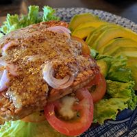 Open Tempeh sandwich with mustard sauce and extra avocado at Simple Things in Kampot