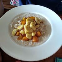 Coconut oatmeal with caramelized fruit at Simple Things in Kampot