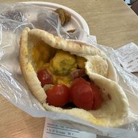 Gyro Pita (they give it to you with just the meat and you must fill it with toppings from salad bar yourself, I added cheese sauce instead of the garlic sauce)  at Vegan Love in Budapest