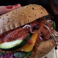 Sweet potato burger with beetroot horseradish creme, sprouts, zucchini, vegan cheddar and and and   at Vegan Love in Budapest