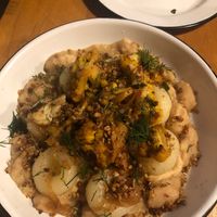 Kluski Slaskie (Silesian potato dumplings with slow cooked giant runners, celeriac root purée, caramelized onion, cauliflower, sunflower seed, scallion, fried buckwheat, and dill) at Apteka in Pittsburgh
