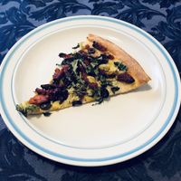 A slice of Aphrodite with vegan cheese  at Blue Line Pizza in Burlingame