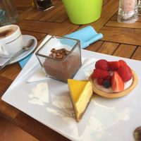 The mixed desert plate with an oat-cappuccino  at Eqvita in 