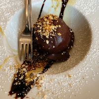 Baciami ancora dessert, filled with hazelnut semifreddo, salt caramel on a biscuit,  covered in rocher glaze at Rifugio Romano in Rome