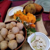 Vegan appetizer with one arancino, one supplì, marinated tofu, hummus+vegetables, mayo, fried pizza dough  at Rifugio Romano in Rome