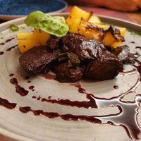 Something delicious with seiten and potatoes at Rifugio Romano in Rome