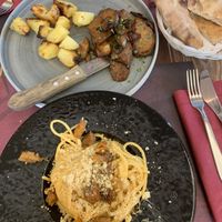 Grilled seitan (AMAZING) and carbonara  at Rifugio Romano in Rome