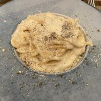 Tonnarelli cacio e pepe, pasta with vegan pecorino cheese and black pepper, deliciously creamy   at Rifugio Romano in Rome
