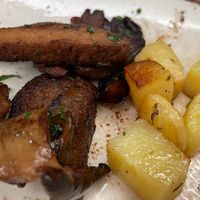 A small view of the seitan stew with porcini mushrooms and backed potatoes, the best seitan dishes ever: scrumptious and crispy   at Rifugio Romano in Rome