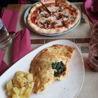 Spinach fritatta and vegan pizza with smoked sausage at Rifugio Romano in Rome