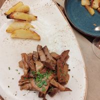 Tagliata di seitan ai funghi at Rifugio Romano in Rome