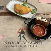 Sofficini (fried half moon filled with sauce) & supplì (deep fried rice ball with vegan cheese and tomato sauce)  at Rifugio Romano in Rome