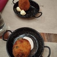 Arancini: above is "sea taste" and below is classic at Rifugio Romano in Rome