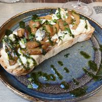 Bruschettone with cashew gorgonzola, sauted porcini mushrooms, Maldon salt and basil reduction  at Rifugio Romano in Rome