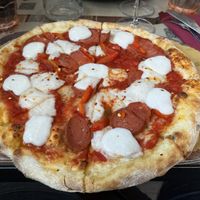 La Diavola Vegan del Rifugio (Tomato Sauce, Vegan Mozzarella Cheese, Spicy Vegan Salami, Chilli, mozzarella cream)  at Rifugio Romano in Rome