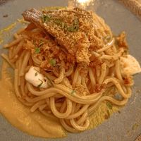 Tonnarelli all'aglio nero fiori di zucca e scamorza affumicata at Rifugio Romano in Rome