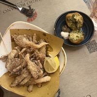 Arancini (right) and fried oyster mushrooms (left)  at Rifugio Romano in Rome
