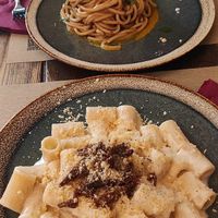 Mezze maniche alla Gricia and tonello all'aglio nero e fiori di zucca at Rifugio Romano in Rome