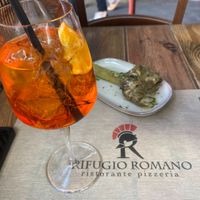 Aperol spritz and Roman-style artichoke at Rifugio Romano in Rome