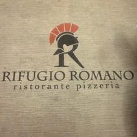 Logo: Is it a centurion helmet or a cartoon chicken? Maybe both! at Rifugio Romano in Rome