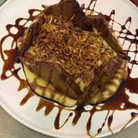 Soy marinated tempeh with fig absolute essence, potato purée and carrots chips.  at Rifugio Romano in Rome