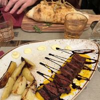 We ordered Calzone & 3D printed steak. Curious  at Rifugio Romano in Rome