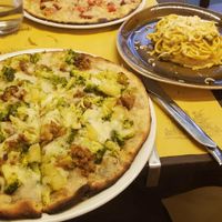 vegan Pizza with 4 different kinds of cheese and sausage, vegan Pizza with broccoli, potatoes, "meat" and mozarella and vegan Carbonara! at Rifugio Romano in Rome