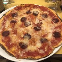 Vegan salami and mozzarella pizza at Rifugio Romano in Rome