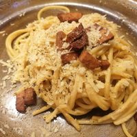 Vegan spaghetti carbanara - scrambled tofu as the base. Topped with vegan parmesan and seitan. at Rifugio Romano in Rome