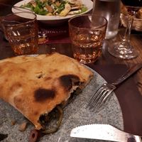 Incredible calzone, salad in the background at Rifugio Romano in Rome