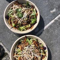 The bowl of the week , noodles with tempeh , zoodles, broccoli, sweet potato ,…. at PLUS in Ghent