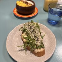 Açaí bowl and avocado „toast” with tropical fruits smoothie and detox juice.  at Herbivore in Prague