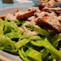 Tagliatelle with spinach sauce, baked, smoked tofu, sundried tomatos and cashew parmesan at Herbivore in Prague