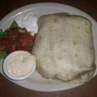 Their burritos are huge!! This is the fajita burrito and it was super delicious. Get it with vegan cheese and vegan dipping sauces!   at Mad Mex in Columbus