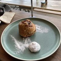 Sticky Cinnamon Almond Bun with coconut cream   at Bespoke Kitchen  in Queenstown