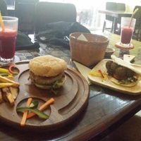Mixed mushroom burger, falafel burger, fresh juice with apple carrot beetroot and ginger. Plus extra fries :D at Karma Kitchen in Chiang Mai